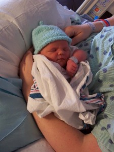 newborn hospital VBAC baby boy in handmade knitted hat