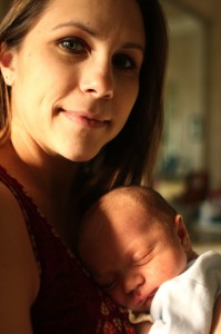 Mother and baby son in sunlight