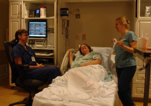 Midwife Cecily, doula Delilah and Helen laughing between contractions