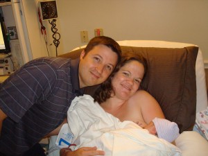 Dad, Mom and newborn baby