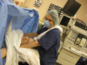 doula Delilah with Erin in operating room for cesarean