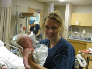 doula Delilah with baby Gage in c-section recovery room