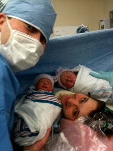 Mother, Father, and twin babies after cesarean birth